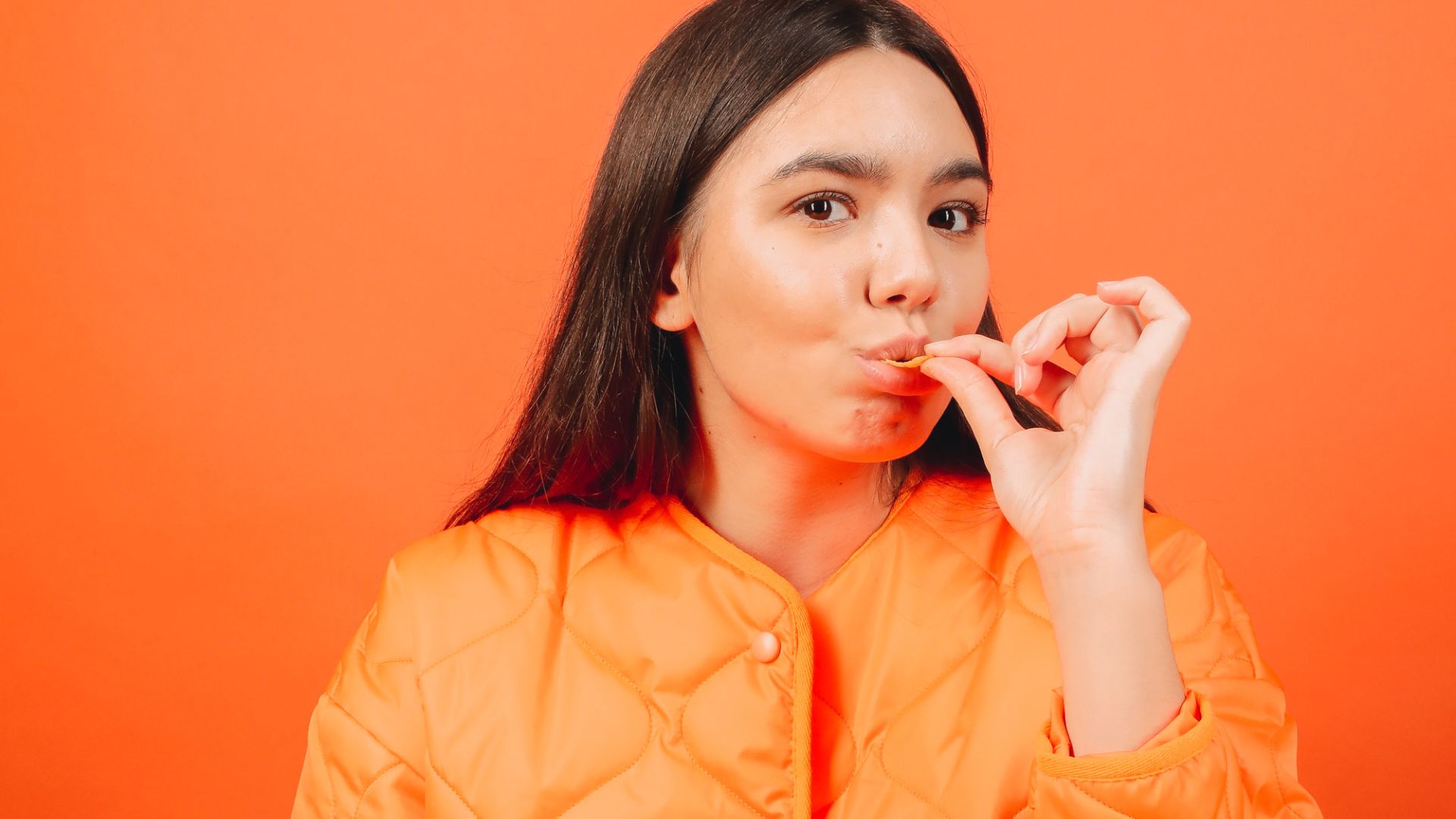 orange coat brunette girl